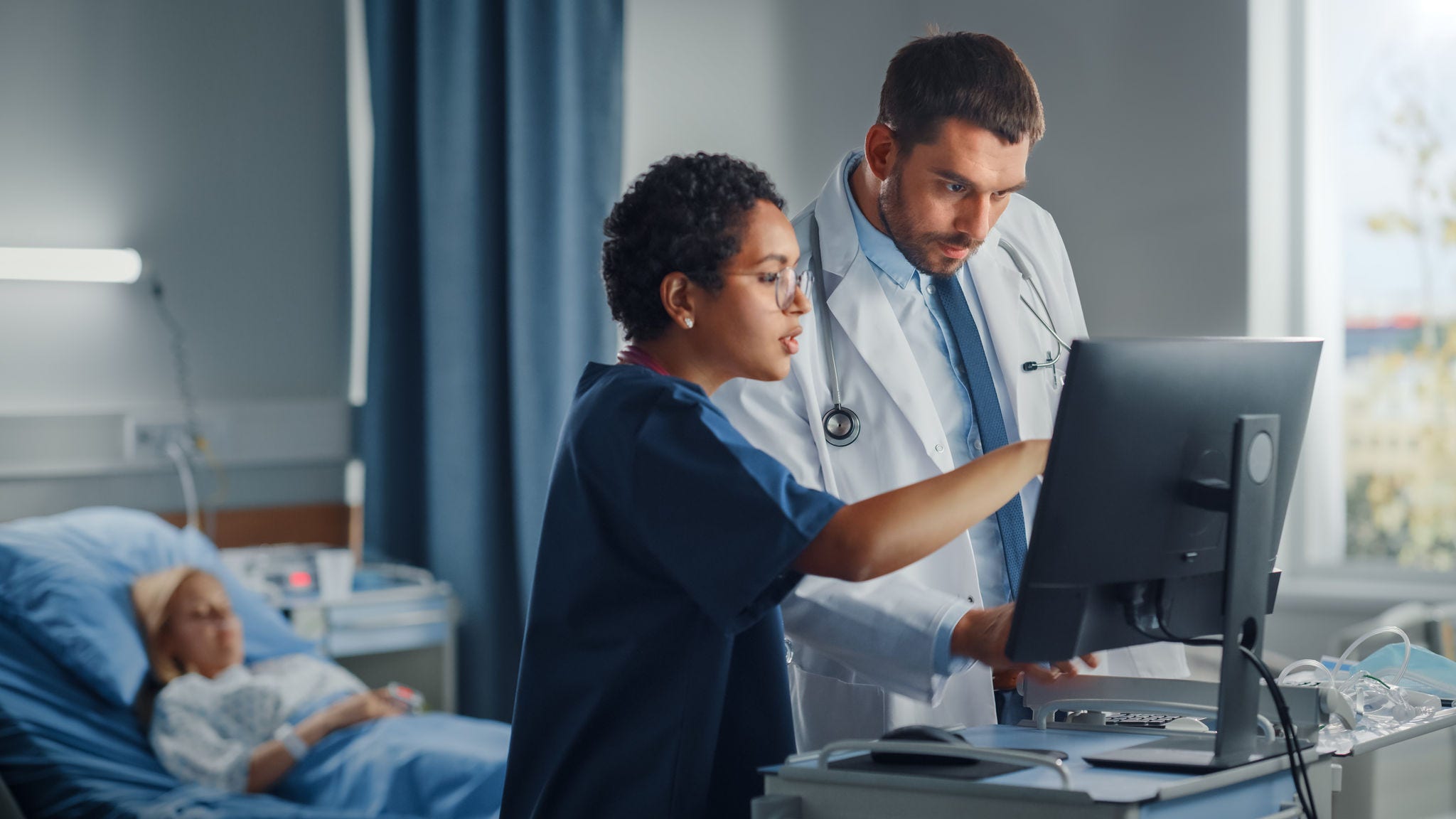 Doctors Looking at Computer Screen doctors-looking-at-computer-screen