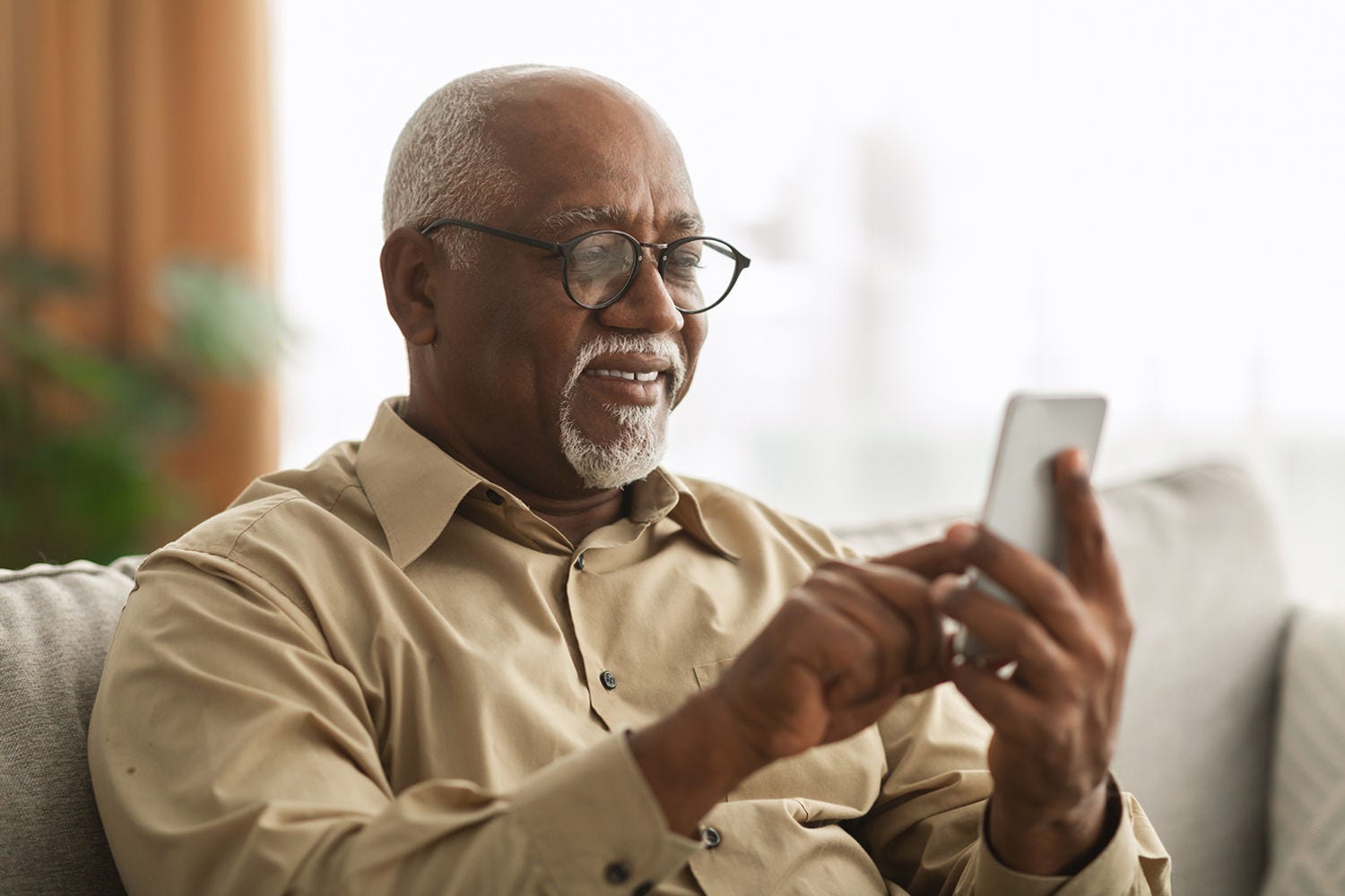 Old man looking at phone screen Old man looking at phone screen