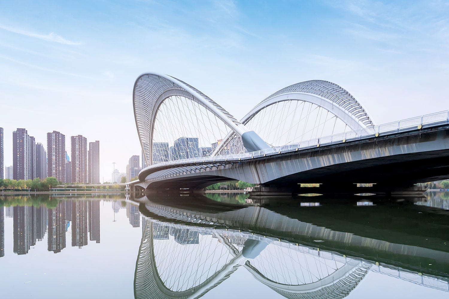 Skyline against a river and a bridge Skyline against a river and a bridge